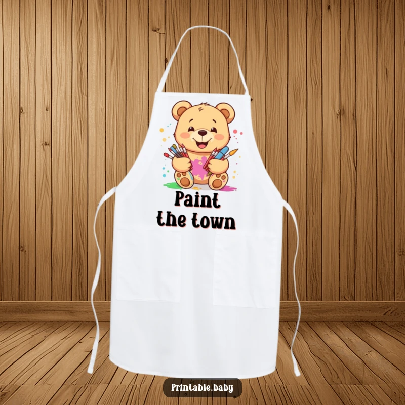 Funny smiling teddy bear apron, with paint splatters, ideal for protecting clothes during artistic activities with a humorous touch.