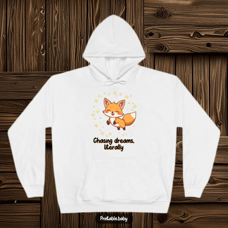 Funny Hoodie depicting a smiling fox leaping through twinkling constellations, offering warmth and whimsical celestial charm.