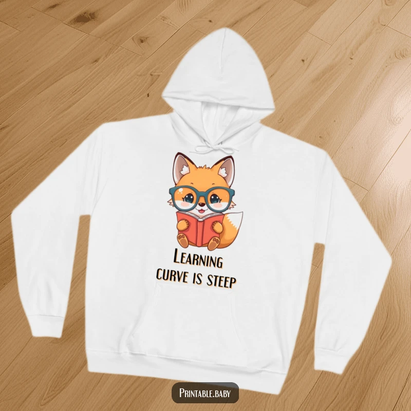 Funny baby fox wearing oversized glasses, reading upside down, on a comfortable hoodie, great for witty humor.