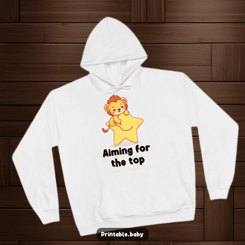 Funny hoodie featuring a brave lion cub climbing a smiling star, offering warmth and a symbol of courage and ambition.