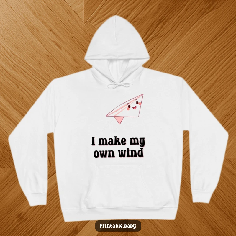 Funny paper airplane hoodie featuring a cheerful character soaring, leaving a trail, perfect for staying warm and stylishly fun.