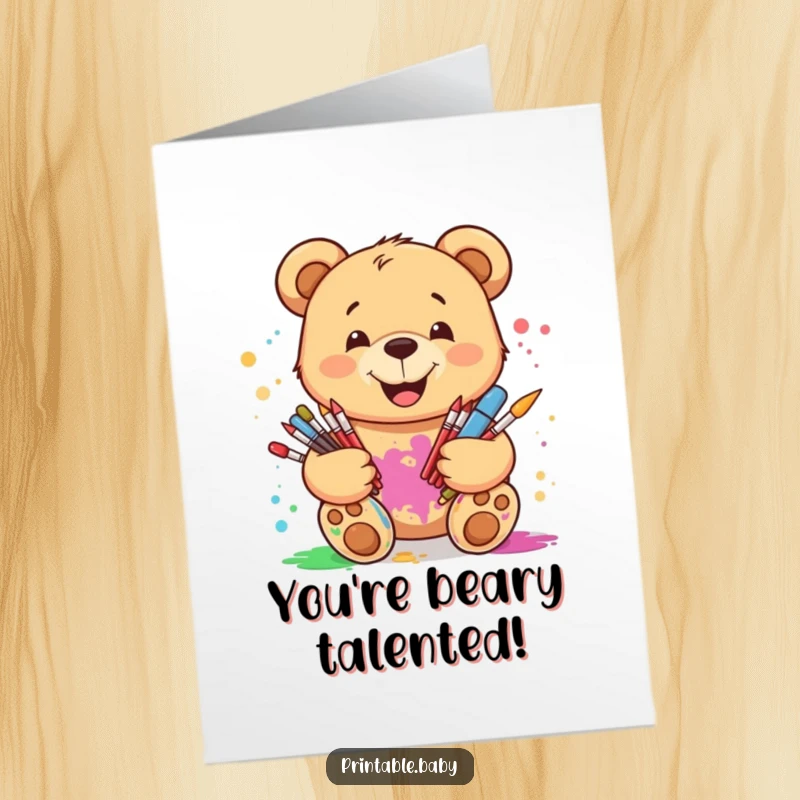 Funny Free Printable Congratulations Card: Smiling teddy bear splattered with paint, holding art supplies, celebrating success.