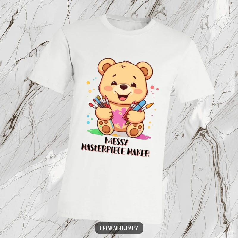 Funny smiling teddy bear t-shirt, holding art supplies, with paint splatters, showcasing a love for art and creativity.
