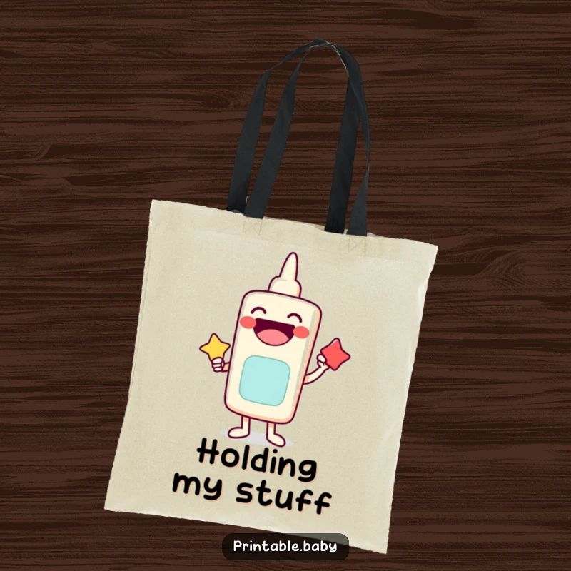 Funny tote bag featuring a laughing glue stick character sticking shapes together, durable and stylish accessory.